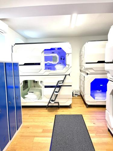 a hospital room with two beds and a treadmill at Space Home Apartment - Prater in Vienna