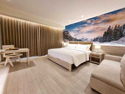 Postel nebo postele na pokoji v ubytování Hemangini Hotel Bandung