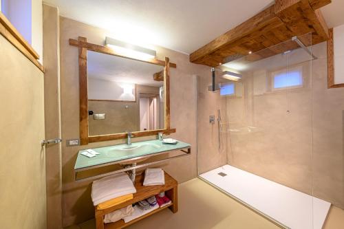 a bathroom with a sink and a shower at Hotel Ambrosini in Aprica