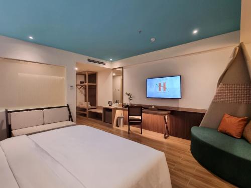 Postel nebo postele na pokoji v ubytování Hemangini Hotel Bandung