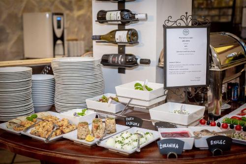 a buffet of food on a table with plates at Termy Szaflary in Szaflary