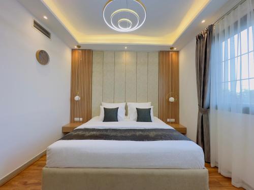 Кровать или кровати в номере GOODWOOD SUITES HOMES VACATION