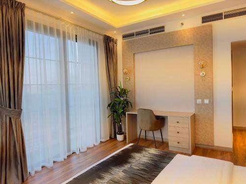 Кровать или кровати в номере GOODWOOD SUITES HOMES VACATION