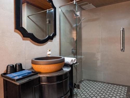 a bathroom with a sink and a shower at La Pandora Boutique Cruises in Ha Long