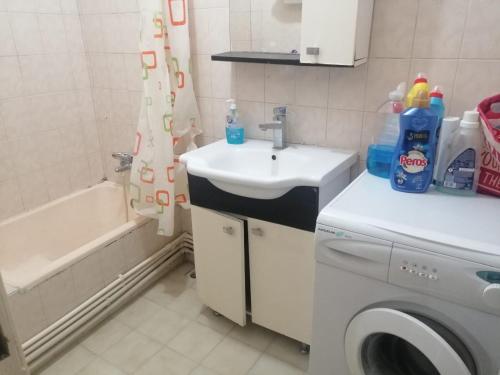 a bathroom with a sink and a washing machine at Private Room in Istanbul #10 in Istanbul