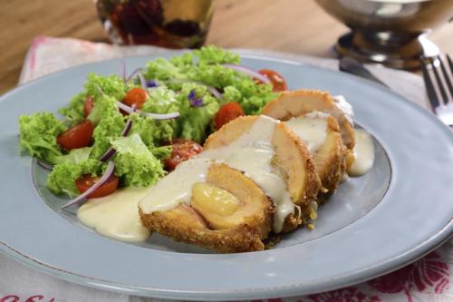 a plate of food with a salad on a table at HOTEL EMPRESARIAL Arcoiris de mi llano in Paz de Ariporo