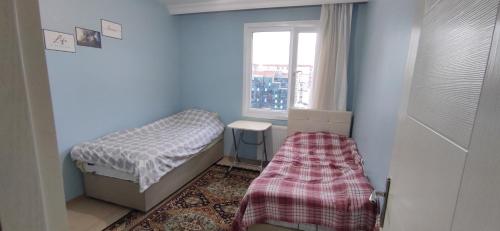 a small room with two beds and a window at Private Room in Istanbul #16 in Istanbul