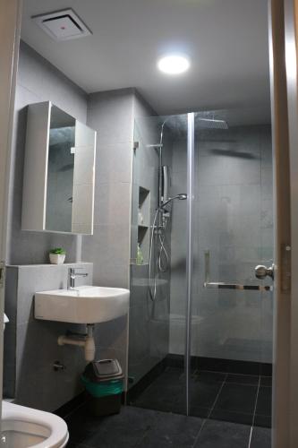 a bathroom with a shower and a sink at MLH Designer Suites @ Jesselton Quay CityPads in Kota Kinabalu