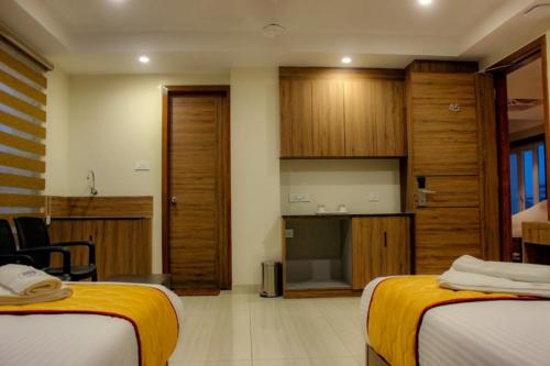 Cama o camas de una habitación en RR Mount Elite Suites