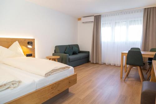 Кровать или кровати в номере Hotel Olympica