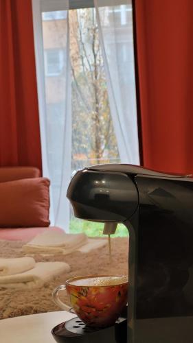 a bowl on a counter next to a microwave at Green Terrace Family Apartment in Wrocław