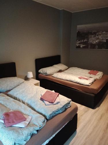 a room with two beds with towels on them at Flensburg Strandnah in Flensburg