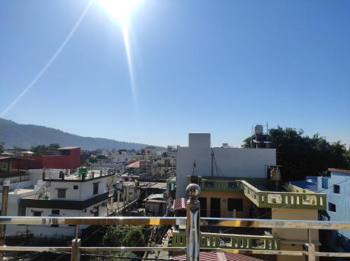 a view of a city from the roof of a building at Anandam Home Stay in Rishīkesh