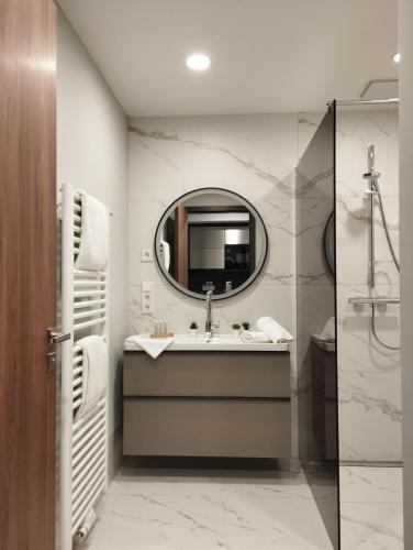 a bathroom with a sink and a mirror at Hotel Herzog Georg in Bad Liebenstein