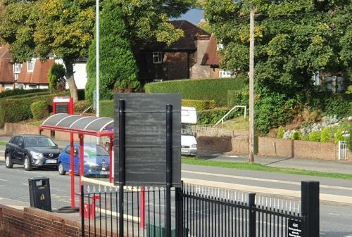 a bus stop on the side of a street at *F1*5GH* Setup for your most relaxed & amazing stay + Free Parking + Free Fast WiFi * in Leeds