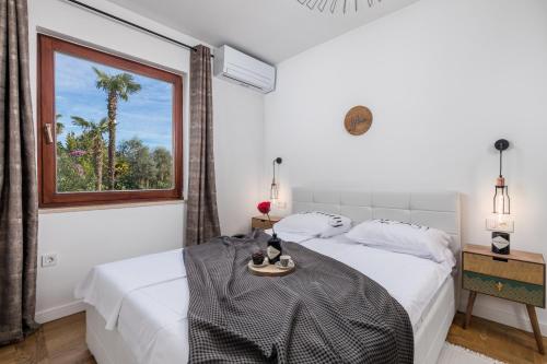 Posteľ alebo postele v izbe v ubytovaní Apartment Mak