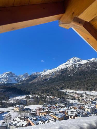 a view of a town with snow covered mountains at Al Marchior in Andalo