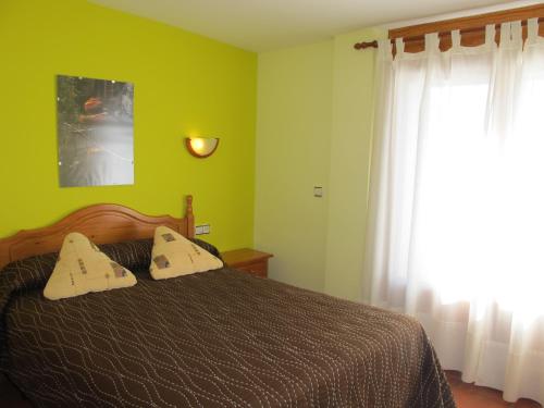 Ένα ή περισσότερα κρεβάτια σε δωμάτιο στο Hostal Gúdar