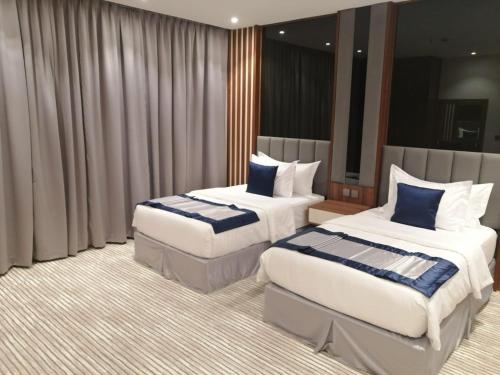 Katil atau katil-katil dalam bilik di Tulip View Hotel
