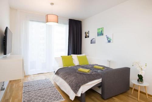 A bed or beds in a room at Premium City Apartment with balcony! Free Garage Parking included!