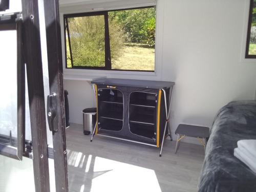 a room with a desk in a room with a window at Cable Bay Farm in Nelson