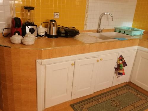a kitchen with a sink and a counter top at Huge Cozy Apartment in Larache