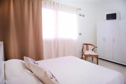Cama o camas de una habitación en Hostal Mamamambo