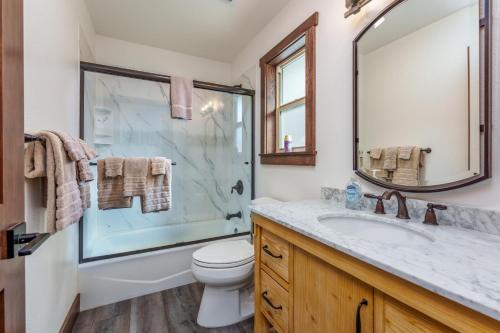 a bathroom with a shower and a toilet and a sink at Devonshire - Aragon in Yosemite West