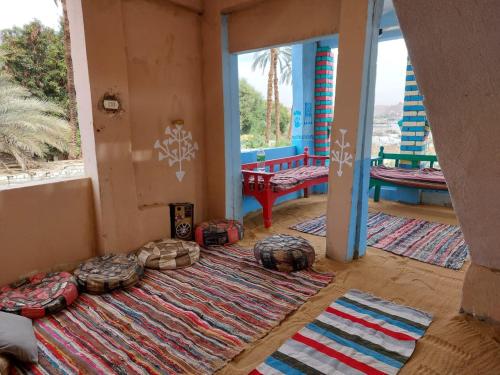 a room with a large rug on the floor at ارجوندي جيست هاوس in Aswan