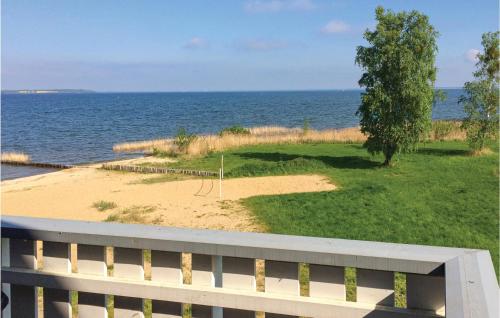 a view of a beach with a tree and the ocean at Gorgeous Apartment In Rechlin With Wifi in Rechlin