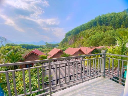 a balcony with a view of a mountain at The Hill Villas in Phong Nha