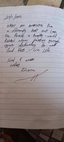 a letter with handwriting on a piece of paper at Whispering Gardens in Stilbaai