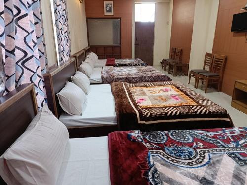 Postel nebo postele na pokoji v ubytování Rainbow Cottages-Budget Friendly rooms