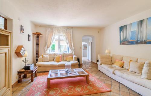 a living room with a couch and a table at Maison Des Rêves in Saint-Cézaire-sur-Siagne