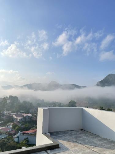 a view from the roof of a building with clouds at Samu Bac Ha Hotel in Lao Cai