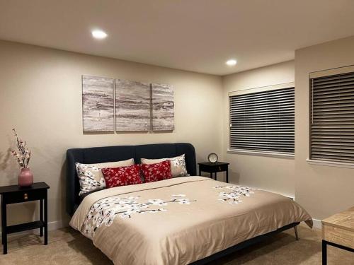 a bedroom with a bed with red pillows at Luxury Condo-Downtown Bellevue in Bellevue