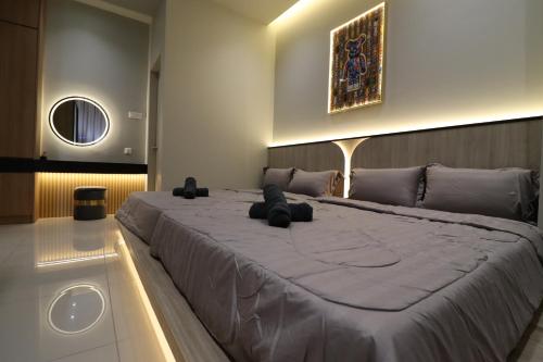a large bed in a room with a large bedvisor at Mykey Bali B-07-01 Melaka City in Melaka