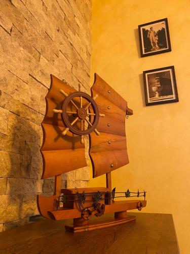 a wooden boat on display in front of a wall at Motel pizzeria Antic's in Laktaši