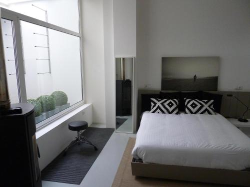 Postel nebo postele na pokoji v ubytování Oktheway Loft Santander Street