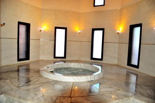 a large room with a large tub in the middle of a building at ONATTI Beach Resort - Marsa Alam in Quseir