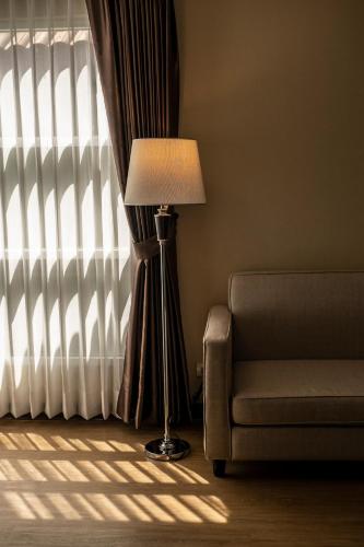 Χώρος καθιστικού στο Sinsuvarn Airport Suite Hotel