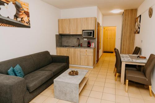 a living room with a couch and a table at Fatrapark 2, Ap217 in Ružomberok