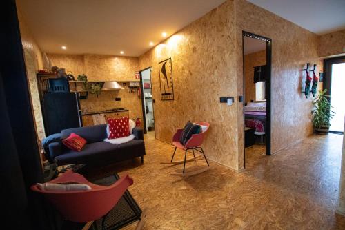 a living room with a couch and a chair at casinha do corvo in Fátima