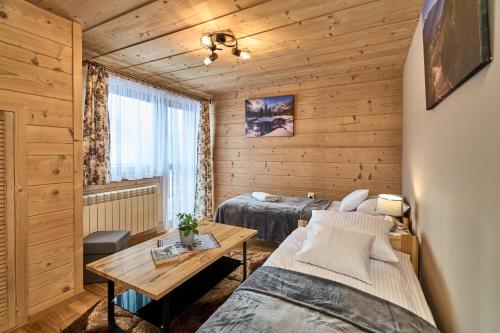 Postel nebo postele na pokoji v ubytování Apartament U Gosi