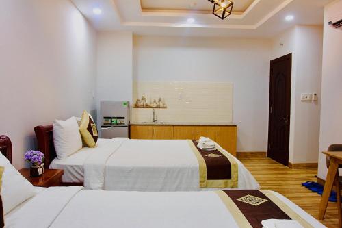 Katil atau katil-katil dalam bilik di The Lumiere near Tan Son Nhat Airport