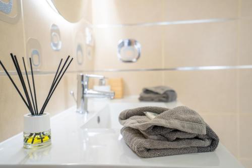 a bathroom with a towel sitting on a sink at Ocean Vibes with sea view and private heated pool in Callao Salvaje