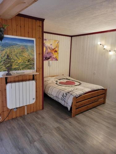 Postel nebo postele na pokoji v ubytování Le Nid Du Caveau