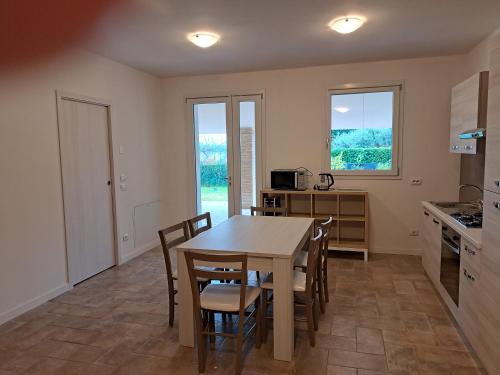 a kitchen and dining room with a table and chairs at Casa sul Conca in San Giovanni in Marignano