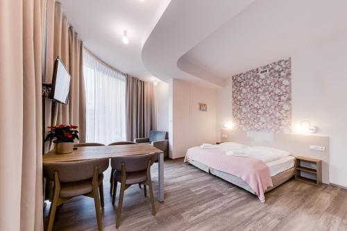 Una cama o camas en una habitación de Kora Apartments