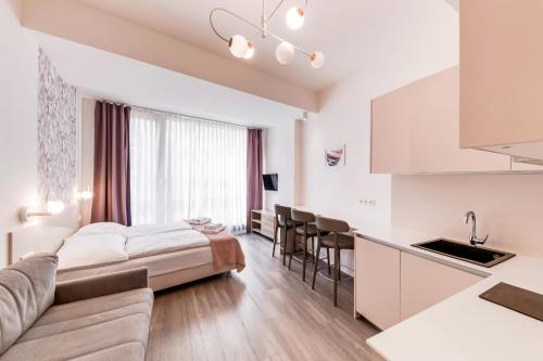 Una cama o camas en una habitación de Kora Apartments
